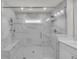 Beautiful marble-tiled walk-in shower with glass doors at 2530 Clairebrooke Bend, Atlanta, GA 30341
