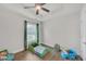 Bedroom featuring hardwood floors, one window and a fan at 2530 Clairebrooke Bend, Atlanta, GA 30341