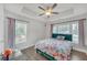 Bedroom featuring hardwood floors, fan, a bed and two large windows at 2530 Clairebrooke Bend, Atlanta, GA 30341