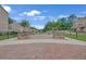 Well-kept community area with brick walkways, seating, landscaping, and inviting atmosphere for residents at 2530 Clairebrooke Bend, Atlanta, GA 30341