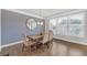 Dining room with decorative wallpaper, and large windows offering natural light at 2530 Clairebrooke Bend, Atlanta, GA 30341