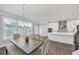 Open dining area featuring a rustic table and chairs with large windows at 2530 Clairebrooke Bend, Atlanta, GA 30341