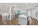 Open concept kitchen with island seating and easy access to both dining and living areas at 2530 Clairebrooke Bend, Atlanta, GA 30341
