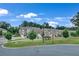 A street view of well-maintained townhomes with landscaping, sidewalks, and a clear blue sky at 2530 Clairebrooke Bend, Atlanta, GA 30341