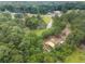 Aerial view of home, barn, sheds, and other outbuildings on the property at 2827 Highway 138 Ne, Conyers, GA 30013
