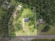 Aerial view of the property's acreage and boundaries, showing a long driveway at 2827 Highway 138 Ne, Conyers, GA 30013
