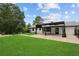 Backyard featuring a lush lawn, patio, and modern pergola for outdoor living and entertaining at 2827 Highway 138 Ne, Conyers, GA 30013