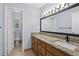 Bathroom featuring a long vanity, lighted mirror, and stylish fixtures at 2827 Highway 138 Ne, Conyers, GA 30013