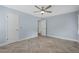 Cozy bedroom features herringbone floors, fresh paint, and an ensuite closet at 2827 Highway 138 Ne, Conyers, GA 30013