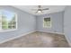 Bright bedroom featuring beautiful herringbone floors, fresh paint, and natural light at 2827 Highway 138 Ne, Conyers, GA 30013