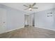 This bedroom features herringbone floors, ample closet space, and fresh paint at 2827 Highway 138 Ne, Conyers, GA 30013