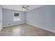 An airy bedroom featuring beautiful herringbone floors and a modern ceiling fan at 2827 Highway 138 Ne, Conyers, GA 30013