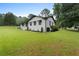 Side view of a one story home, landscaped with fresh mulch at 2827 Highway 138 Ne, Conyers, GA 30013