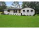 Charming one-story home with a beautifully landscaped front yard, updated with black accents at 2827 Highway 138 Ne, Conyers, GA 30013