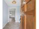 Light and airy foyer with herring bone floors, light paint and natural wood door at 2827 Highway 138 Ne, Conyers, GA 30013