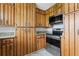 Kitchen featuring stainless steel appliances, wooden cabinets, subway tile backsplash, and herringbone floors at 2827 Highway 138 Ne, Conyers, GA 30013