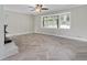 Spacious living room with a fireplace, herringbone floors, and large windows offering backyard views at 2827 Highway 138 Ne, Conyers, GA 30013