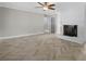 Bright living room featuring a fireplace and beautiful herringbone floors and neutral color palette at 2827 Highway 138 Ne, Conyers, GA 30013