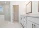 Bathroom featuring a double vanity, quartz countertop, and a modern glass shower at 350 Olmstead Way # 29, Alpharetta, GA 30022