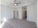 Open bedroom featuring neutral carpet, white walls and trim, and easy access to ensuite bathroom at 350 Olmstead Way # 29, Alpharetta, GA 30022