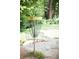 A disc golf basket with chain, number 17 sign, in a grassy park setting at 350 Olmstead Way # 29, Alpharetta, GA 30022