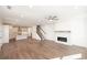 Open-concept living area with kitchen, fireplace, staircase, and hardwood floors throughout at 350 Olmstead Way # 29, Alpharetta, GA 30022