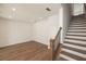 Empty room with hardwood flooring, recessed lighting, staircase, and a neutral color palette at 350 Olmstead Way # 29, Alpharetta, GA 30022