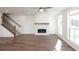 Bright living room features fireplace, hardwood floors, and lots of natural light at 350 Olmstead Way # 29, Alpharetta, GA 30022