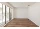 Bright, empty room featuring hardwood floors, recessed lighting, and large glass sliding doors at 350 Olmstead Way # 29, Alpharetta, GA 30022
