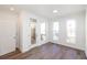 Bright and airy living area with hardwood floors, large windows, and private balcony at 350 Olmstead Way # 29, Alpharetta, GA 30022