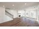 Bright living room features fireplace, hardwood floors, crown molding, and lots of natural light at 350 Olmstead Way # 29, Alpharetta, GA 30022