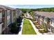 Street view of newly constructed townhomes featuring manicured lawns at 350 Olmstead Way # 29, Alpharetta, GA 30022