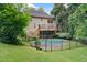 Exterior view of backyard with deck, pool, and lush landscaping at 1488 Lachona Ne Ct, Atlanta, GA 30329