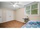 Cozy bedroom with double closet doors, window, and carpet at 1488 Lachona Ne Ct, Atlanta, GA 30329