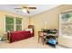 Comfortable bedroom with natural light, a ceiling fan, and a large window at 1488 Lachona Ne Ct, Atlanta, GA 30329