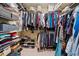 Walk-in closet with organized shelving and hanging racks, providing abundant storage for clothes and accessories at 1488 Lachona Ne Ct, Atlanta, GA 30329