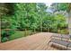 Large wooden deck with lounge chairs and view of backyard at 1488 Lachona Ne Ct, Atlanta, GA 30329