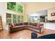 Bright living room with high ceilings, large windows, and comfortable seating area at 1488 Lachona Ne Ct, Atlanta, GA 30329