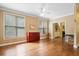Living room with hardwood floors and large windows and view into the room with the fireplace at 1488 Lachona Ne Ct, Atlanta, GA 30329