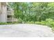 Spacious backyard featuring mature trees and a patio, creating a private outdoor space at 1757 E Clifton Ne Rd, Atlanta, GA 30307