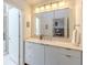 Bright bathroom features marble countertops, modern cabinets, and large mirror at 1757 E Clifton Ne Rd, Atlanta, GA 30307
