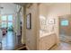 Bathroom featuring double vanity sinks, stylish lighting, and tiled floors at 1757 E Clifton Ne Rd, Atlanta, GA 30307