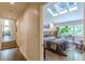 Hallway view into a charming bedroom featuring a skylight and several windows at 1757 E Clifton Ne Rd, Atlanta, GA 30307
