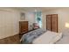 Cozy bedroom with hardwood floors, decorative screen, armchair and double door closet at 1757 E Clifton Ne Rd, Atlanta, GA 30307