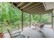 Spacious outdoor deck with a cozy seating area surrounded by lush greenery at 1757 E Clifton Ne Rd, Atlanta, GA 30307