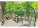 Outdoor deck features a grill, dining area, and comfortable hanging chair for relaxing at 1757 E Clifton Ne Rd, Atlanta, GA 30307