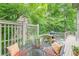 Cozy upper deck with dining set, grill and swing chair provides lovely place to relax or grill at 1757 E Clifton Ne Rd, Atlanta, GA 30307