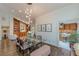 Open-concept dining area with view into library, dining table, and kitchen access at 1757 E Clifton Ne Rd, Atlanta, GA 30307