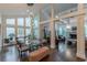 Bright dining room with a glass table, large windows, and modern lighting at 1757 E Clifton Ne Rd, Atlanta, GA 30307