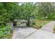 Picturesque driveway leading to a house nestled among trees, with blooming flowers at 1757 E Clifton Ne Rd, Atlanta, GA 30307